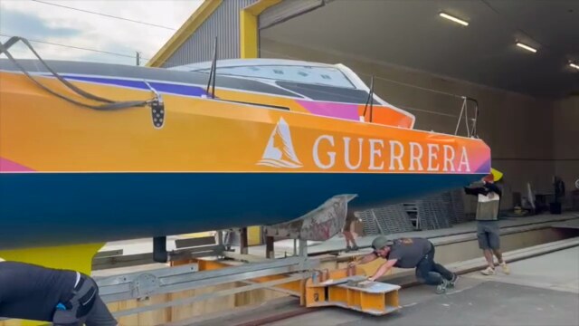 Guerrera in the shed before launch, nameplate and hull graphics visible, crew making final preparations